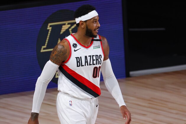 Portland Trail Blazers' Carmelo Anthony reacts after being charged with an offensive foul against the Los Angeles Lakers in Game 4 of an NBA basketball first-round playoff series, Monday, Aug. 24, 2020, in Lake Buena Vista, Fla. (Kevin C. Cox/Pool Photo via AP)