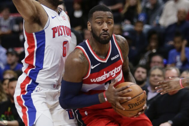 Washington Wizards guard John Wall, right, drives past Detroit Pistons guard Bruce Brown (6) during the second half of an NBA basketball game Wednesday, Dec. 26, 2018, in Detroit. The Pistons defeated the Wizards 106-95. (AP Photo/Duane Burleson)