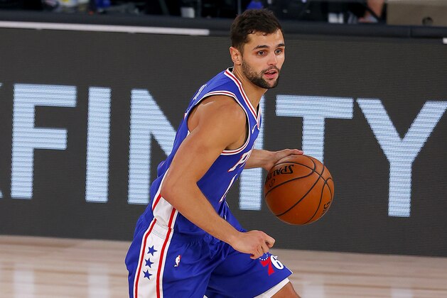 Philadelphia 76ers' Raul Neto handles the ball on offense against the San Antonio Spurs during the third quarter of an NBA basketball game Monday, Aug. 3, 2020, in Lake Buena Vista, Fla. (Mike Ehrmann/Pool Photo via AP)