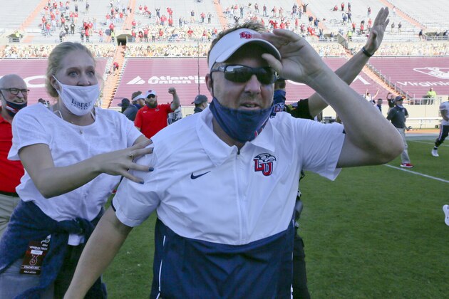 Liberty Head Coach Hugh Freeze celebrates after they defeated the Virginia Tech in an NCAA college football game, Saturday, Nov. 7 2020, in Blacksburg, Va. (Matt Gentry/The Roanoke Times via AP, Pool)