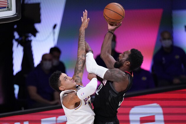 Los Angeles Lakers' Kyle Kuzma, left, defends on Houston Rockets' Jeff Green during the second half of an NBA conference semifinal playoff basketball game Saturday, Sept. 12, 2020, in Lake Buena Vista, Fla. (AP Photo/Mark J. Terrill)