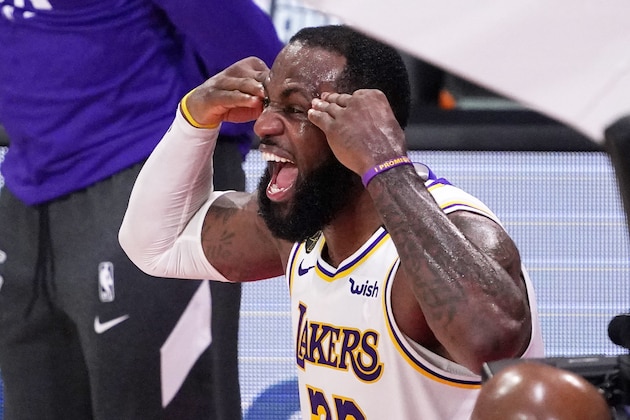 Los Angeles Lakers' LeBron James (23) celebrates after the Lakers defeated the Miami Heat 106-93 in Game 6 of basketball's NBA Finals Sunday, Oct. 11, 2020, in Lake Buena Vista, Fla. (AP Photo/Mark J. Terrill)