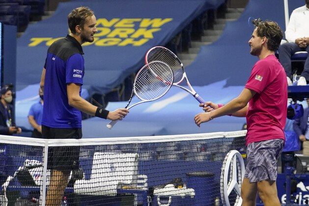 Dominic Thiem, of Austria, right greets Daniil Medvedev, of Russia, at the net after winning their semifinal match of the US Open tennis championships, Friday, Sept. 11, 2020, in New York. (AP Photo/Frank Franklin II)