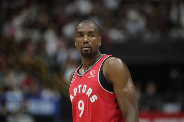 Toronto Raptors' Serge Ibaka stands on the court during the first half of an NBA preseason basketball game against the Houston Rockets Thursday, Oct. 10, 2019, in Saitama, near Tokyo. (AP Photo/Jae C. Hong)