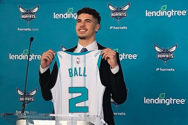 LaMelo Ball, selected by the Charlotte Hornets with the No. 3 overall pick in the NBA draft, holds up his jersey during an introductory news conference on Friday, Nov. 20, 2020, in Charlotte, N.C. (AP Photo/Steve Reed) LaMelo Ball, selected by the Charlotte Hornets with the No. 3 overall pick in the NBA draft, holds up his jersey during an introductory news conference on Friday, Nov. 20, 2020, in Charlotte, N.C. (AP Photo/Steve Reed)