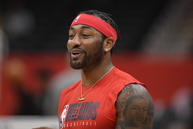 Washington Wizards guard John Wall works out prior to an NBA basketball game against the Milwaukee Bucks, Monday, Feb. 24, 2020, in Washington. (AP Photo/Nick Wass)