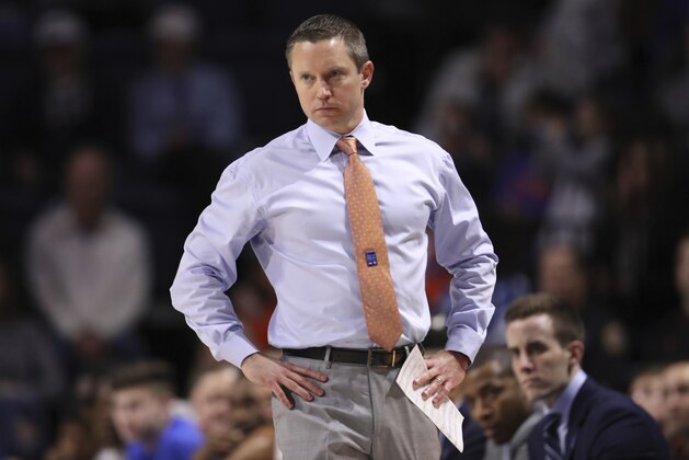 Florida head coach Mike White looks onto the court during the first half of an NCAA college basketball game against Baylor, Saturday, Jan. 25, 2020, in Gainesville, Fla. (AP Photo/Matt Stamey)