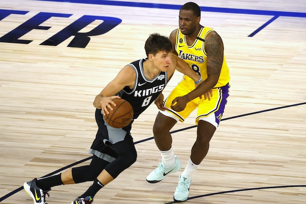 Sacramento Kings' Bogdan Bogdanovic (8) drives against Los Angeles Lakers' Dion Waiters (18) during the second quarter of an NBA basketball game Thursday, Aug. 13, 2020, in Lake Buena Vista, Fla. (Kevin C. Cox/Pool Photo via AP)