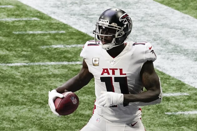 Atlanta Falcons wide receiver Julio Jones (11) lands in the end zone for a touchdown against the Denver Broncosduring the second half of an NFL football game, Sunday, Nov. 8, 2020, in Atlanta. (AP Photo/Brynn Anderson)
