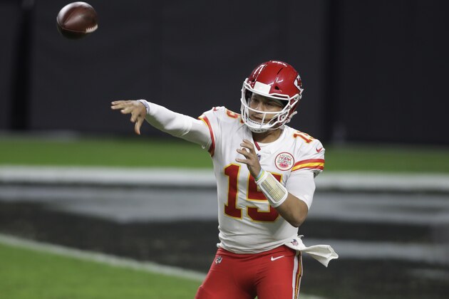 Kansas City Chiefs quarterback Patrick Mahomes (15) throws against the Las Vegas Raiders during the first half of an NFL football game, Sunday, Nov. 22, 2020, in Las Vegas. (AP Photo/Isaac Brekken)