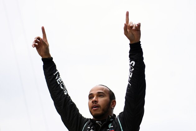Mercedes driver Lewis Hamilton of Britain celebrates after winning the Turkish Formula One Grand Prix at the Istanbul Park circuit racetrack in Istanbul, Sunday, Nov. 15, 2020. (Clive Mason/Pool via AP)