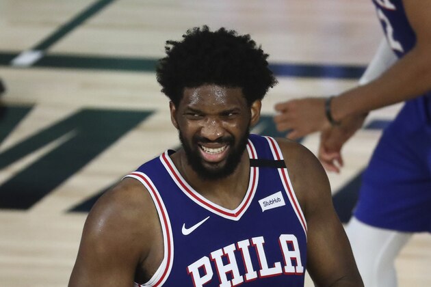 Philadelphia 76ers center Joel Embiid (21) reacts during the second half against the Boston Celtics in Game 3 of an NBA basketball first-round playoff series, Friday, Aug. 21, 2020, in Lake Buena Vista, Fla. (Kim Klement/Pool Photo via AP)
