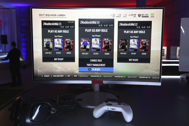 FILE - This Aug. 24, 2017, file photo shows screens of a video game at a Madden NFL 18 Launch Event in New York. The Madden franchise will continue to be a part of the gaming universe for at least the next six years. NFL owners on Thursday, May 28, 2020, approved an extension of their deal with Electronic Arts, continuing a relationship that has existed for 30 years. It was also recently approved by the NFL Players Association. (Mark Von Holden/AP Images for EA SPORTS Madden NFL 18, File)