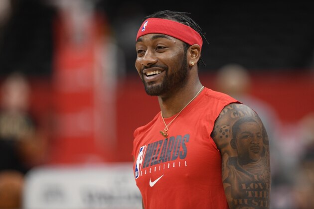 Washington Wizards guard John Wall works out prior to an NBA basketball game against the Milwaukee Bucks, Monday, Feb. 24, 2020, in Washington. (AP Photo/Nick Wass)