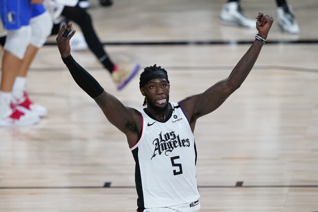 Los Angeles Clippers' Montrezl Harrell (5) celebrates after a dunk during the second half of an NBA basketball first round playoff game against the Dallas Mavericks, Tuesday, Aug. 25, 2020, in Lake Buena Vista, Fla. (AP Photo/Ashley Landis, Pool)