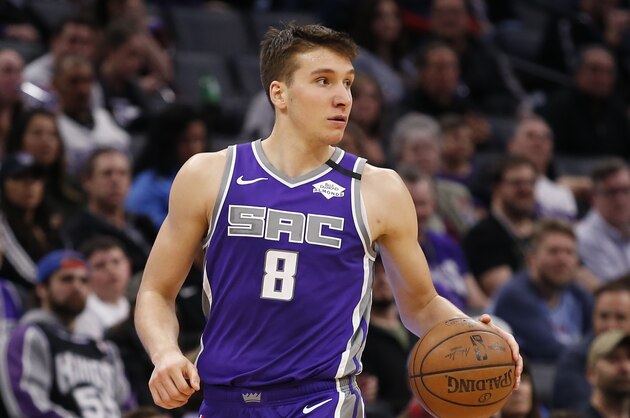 Sacramento Kings guard Bogdan Bogdanovic dribbles down court during the second half of an NBA basketball game against the Toronto Raptors in Sacramento, Calif., Sunday, March 8, 2020. The Raptors won 118-113. (AP Photo/Rich Pedroncelli)