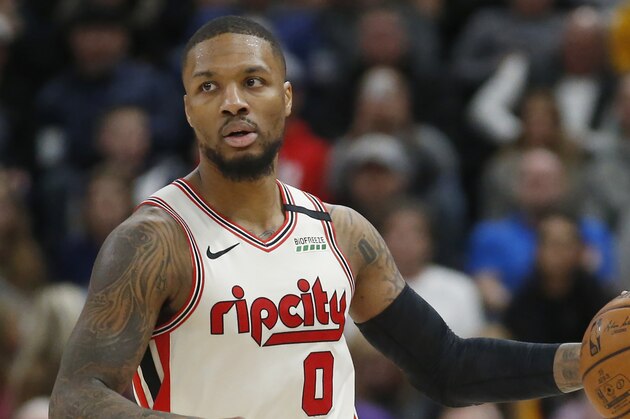 Portland Trail Blazers guard Damian Lillard (0) brings the ball up court in the first half during an NBA basketball game against the Utah Jazz Friday, Feb. 7, 2020, in Salt Lake City. (AP Photo/Rick Bowmer)