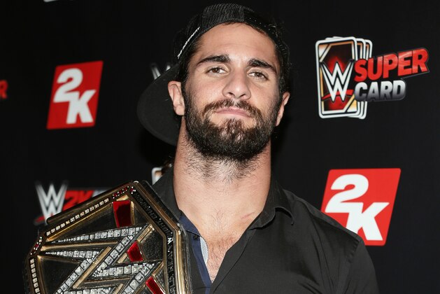 IMAGE DISTRIBUTED FOR 2K - WWE World Heavyweight Champion Seth Rollins poses with his championship title at the WWE 2K SummerSlam Kickoff in New York, N.Y., on Thursday, Aug. 20, 2015. (Photo by Stuart Ramson/Invision for 2K/AP Images)
