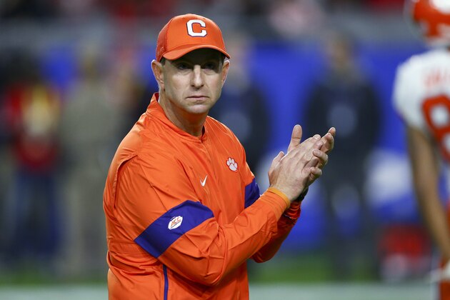 Clemson coach Dabo Swinney watches players warm up for the team's Fiesta Bowl NCAA college football playoff semifinal against Ohio State on Saturday, Dec. 28, 2019, in Glendale, Ariz. (AP Photo/Ross D. Franklin)