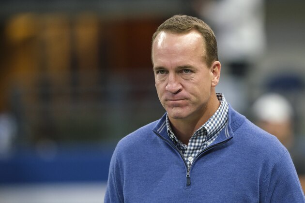 Former Indianapolis Colts quarterback Peyton Manning walks to the field before an NFL football game between the Indianapolis Colts and the Miami Dolphins in Indianapolis, Sunday, Nov. 10, 2019. (AP Photo/AJ Mast)