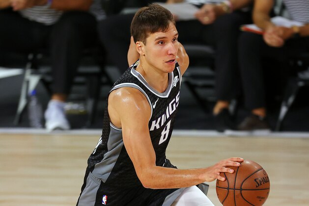 Sacramento Kings' Bogdan Bogdanovic dribbles the ball during the second half of an NBA basketball game against the New Orleans Pelicans Tuesday, Aug. 11, 2020, in Lake Buena Vista, Fla. (Mike Ehrmann/Pool Photo via AP)