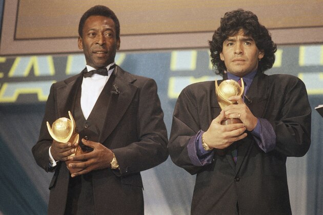 FILE - In this March 1987 file photo, Pele, left, and Maradona hold