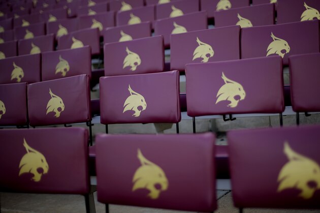 ADVANCE FOR SATURDAY, SEPT. 1 AND THEREAFTER - In this photo taken Aug. 23, 2012, seat backs with the school's Bobcat mascot are seen at Texas State's Bobcat Stadium on the campus of Texas State in San Marcos, Texas. Five programs — Georgia State, Texas-San Antonio, South Alabama, Massachusetts and Texas State — are at various stages in the two-year transition process to the top-tier Football Bowl Subdivision this season. (AP Photo/Eric Gay)