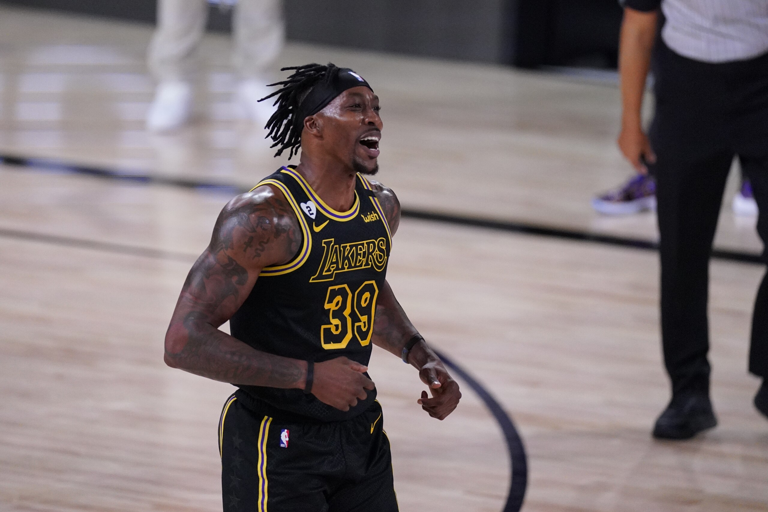 Los Angeles Lakers' Dwight Howard (39) reacts after being called for a foul during the first half of an NBA conference final playoff basketball game against the Denver Nuggets Sunday, Sept. 20, 2020, in Lake Buena Vista, Fla. (AP Photo/Mark J. Terrill) Los Angeles Lakers' Dwight Howard (39) reacts after being called for a foul during the first half of an NBA conference final playoff basketball game against the Denver Nuggets Sunday, Sept. 20, 2020, in Lake Buena Vista, Fla. (AP Photo/Mark J. Terrill)