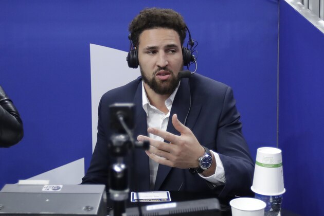 Injured Golden State Warriors guard Klay Thompson gives television analysis during the first half of an NBA basketball game between the Warriors and the Chicago Bulls in San Francisco, Wednesday, Nov. 27, 2019. (AP Photo/Jeff Chiu)
