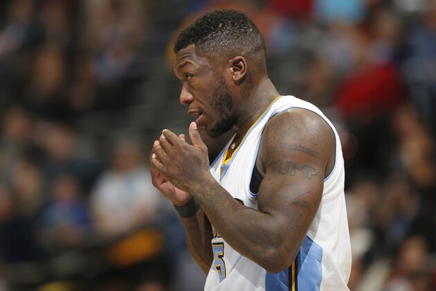 Denver Nuggets guard Nate Robinson looks on against the Orlando Magic in the fourth quarter of an NBA basketball game Wednesday, Jan. 7, 2015, in Denver. The Nuggets defeated the Magic 93-90. (AP Photo/David Zalubowski)