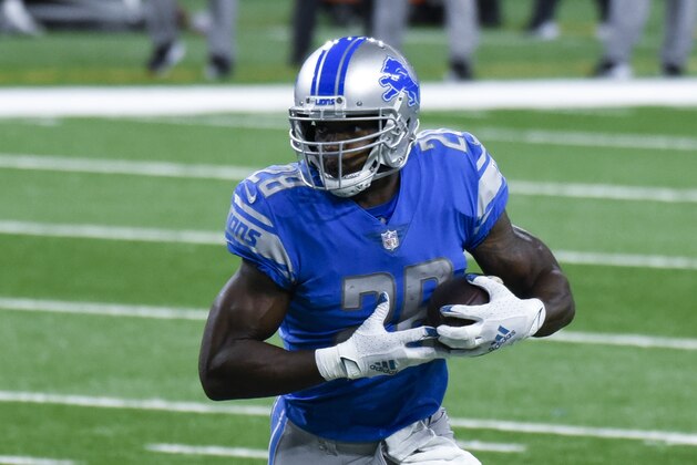 Detroit Lions running back Adrian Peterson runs the ball during the first half of an NFL football game against the New Orleans Saints, Sunday, Oct. 4, 2020, in Detroit. (AP Photo/Jose Juarez)