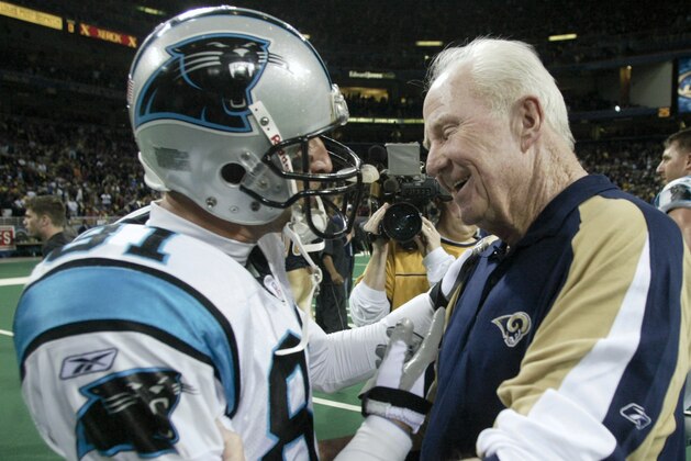 Carolina Panthers' Ricky Proehl is congratulated by St. Louis Rams Offensive Line coach Jim Hanifan after the Panthers beat the Rams 29-23 in an NFC playoff game Saturday, Jan. 10, 2004 in St. Louis. Proehl was facing his old team in the game and Hanifan has announced his retirement. (AP Photo/Tom Gannam)