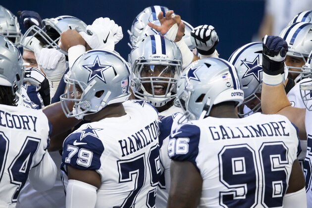 Dallas Cowboys defensive end DeMarcus Lawrence, center, rallies his teammates before an NFL football game against the Washington Football Team, Thursday, Nov. 26, 2020, in Arlington, Texas. (AP Photo/Brandon Wade) Dallas Cowboys defensive end DeMarcus Lawrence, center, rallies his teammates before an NFL football game against the Washington Football Team, Thursday, Nov. 26, 2020, in Arlington, Texas. (AP Photo/Brandon Wade)