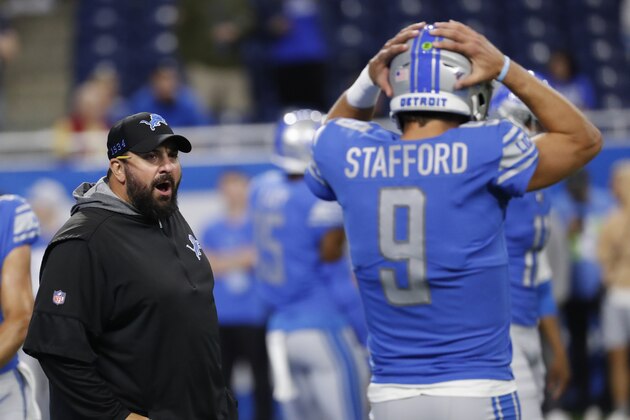 Detroit Lions head coach Matt Patricia talks with quarterback Matthew Stafford before an NFL football game against the Los Angeles Chargers in Detroit, Sunday, Sept. 15, 2019. (AP Photo/Rick Osentoski)