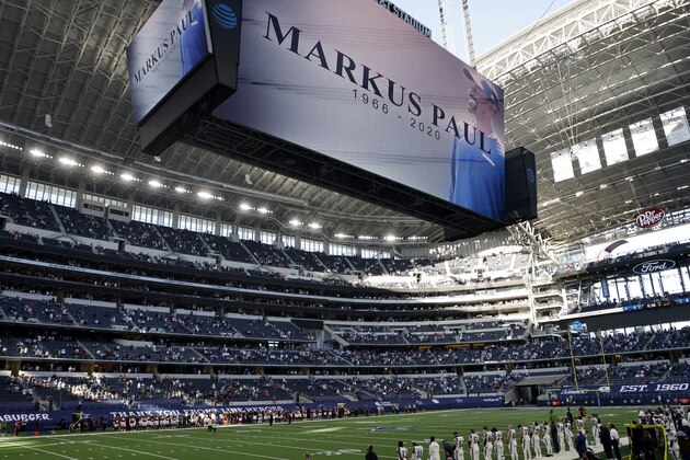 An image of Dallas Cowboys strength and conditioning coordinator Markus Paul is projected on the video screen as all in attendance observe a moment of silence before an NFL football game against the Washington Football Team in Arlington, Texas, Thursday, Nov. 26, 2020. Paul died on Wednesday. (AP Photo/Ron Jenkins)