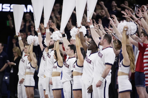 Gonzaga cheerleaders and fans look on during a free throw attempt in the first half of an NCAA college basketball game between Gonzaga and Loyola Marymount in Spokane, Wash., Thursday, Feb. 6, 2020. (AP Photo/Young Kwak)