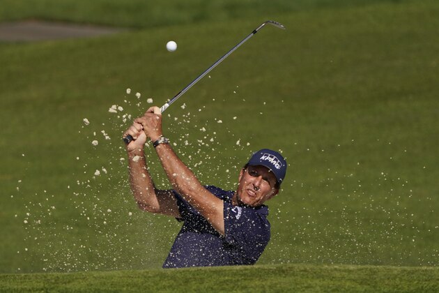 Phil Mickelson chips to the second green during the third round of the Masters golf tournament Saturday, Nov. 14, 2020, in Augusta, Ga. (AP Photo/Chris Carlson)