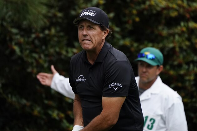 Phil Mickelson watches his shot on the 15th tee during the first round of the Masters golf tournament Friday, Nov. 13, 2020, in Augusta, Ga. (AP Photo/Matt Slocum)
