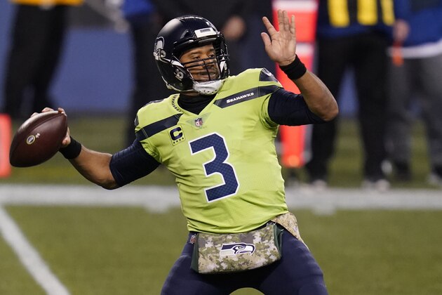 Seattle Seahawks quarterback Russell Wilson passes against the Arizona Cardinals during the first half of an NFL football game, Thursday, Nov. 19, 2020, in Seattle. (AP Photo/Elaine Thompson)
