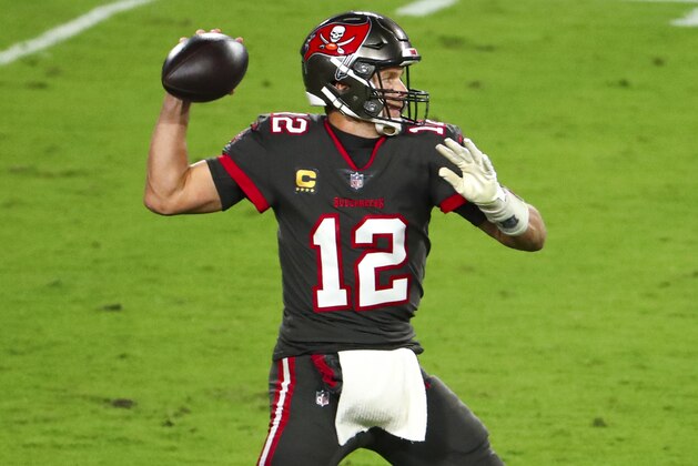 Tampa Bay Buccaneers quarterback Tom Brady (12) throws a pass during the second half of an NFL Football game against the Los Angeles Rams, Monday, Nov. 23, 2020, in Tampa, Fla. (AP Photo/Kevin Sabitus)