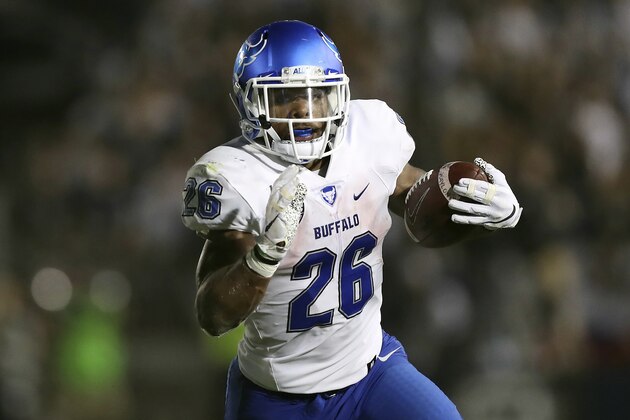 FILE - In this Sept. 7, 2019, file photo, Buffalo running back Jaret Patterson (26) carries the ball during an NCAA college football game against Penn State in State College, Pa. Patterson's 31 career rushing touchdowns are just four short of breaking the school record held by former NFLer James Starks. What's equally impressive, is how sophomore running back has combined for 490 yards and 11 touchdowns (one receiving) in his past two games alone. (AP Photo/Steve Luciano, File)