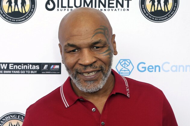 FILE - In this Aug. 2, 2019, file photo, Mike Tyson attends a celebrity golf tournament in Dana Point, Calif. Tyson and Roy Jones Jr. are older, wiser, calmer men than the superstars who dominated their sport. Their fight at Staples Center on Saturday night, Nov. 28, is an eight-round exhibition bout with no official judging and limited violence, although the limit depends on whether you're asking the fighters or the California State Athletic Commission. For Tyson and Jones, this unique pay-per-view boxing match is less of a sporting event and more of a chance for two transcendent athletes to prove age is a number and aging is a choice. (Photo by Willy Sanjuan/Invision/AP, File)