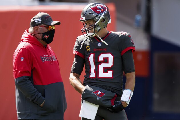Tampa Bay Buccaneers quarterback Tom Brady (12) talks with Tampa Bay Buccaneers head coach Bruce Arians while warming up against the Denver Broncos before NFL football game, Sunday, Sept.. 27, 2020, in Denver. (AP Photo/Justin Edmonds)