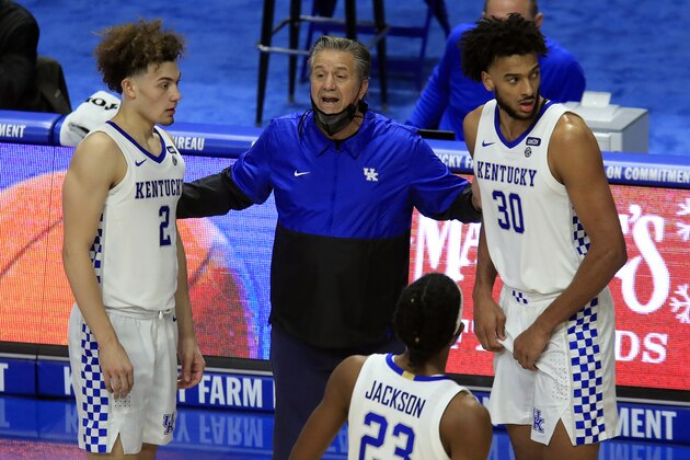 Kentucky coach John Calipari, center, talks to Devin Askew (2), Olivier Sarr (30) and Isaiah Jackson (23) during the second half of the team's NCAA college basketball game against Morehead State in Lexington, Ky., Wednesday, Nov. 25, 2020. (AP Photo/James Crisp) Kentucky coach John Calipari, center, talks to Devin Askew (2), Olivier Sarr (30) and Isaiah Jackson (23) during the second half of the team's NCAA college basketball game against Morehead State in Lexington, Ky., Wednesday, Nov. 25, 2020. (AP Photo/James Crisp)