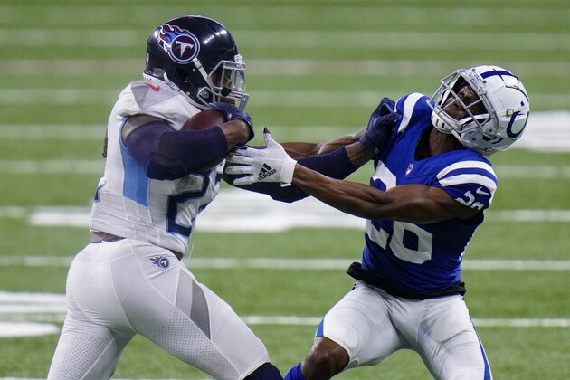 Tennessee Titans running back Derrick Henry (22) tries to get past Indianapolis Colts outside linebacker Darius Leonard (53) in the second half of an NFL football game in Indianapolis, Sunday, Nov. 29, 2020. (AP Photo/AJ Mast)