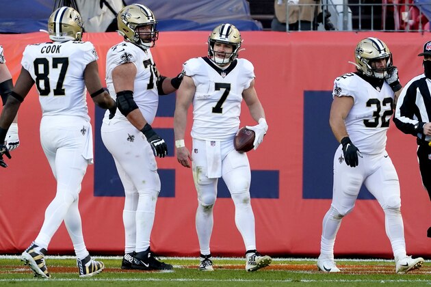New Orleans Saints quarterback Taysom Hill (7) celebrates his rushing touchdown against the Denver Broncos during the first half of an NFL football game, Sunday, Nov. 29, 2020, in Denver. (AP Photo/Jack Dempsey)