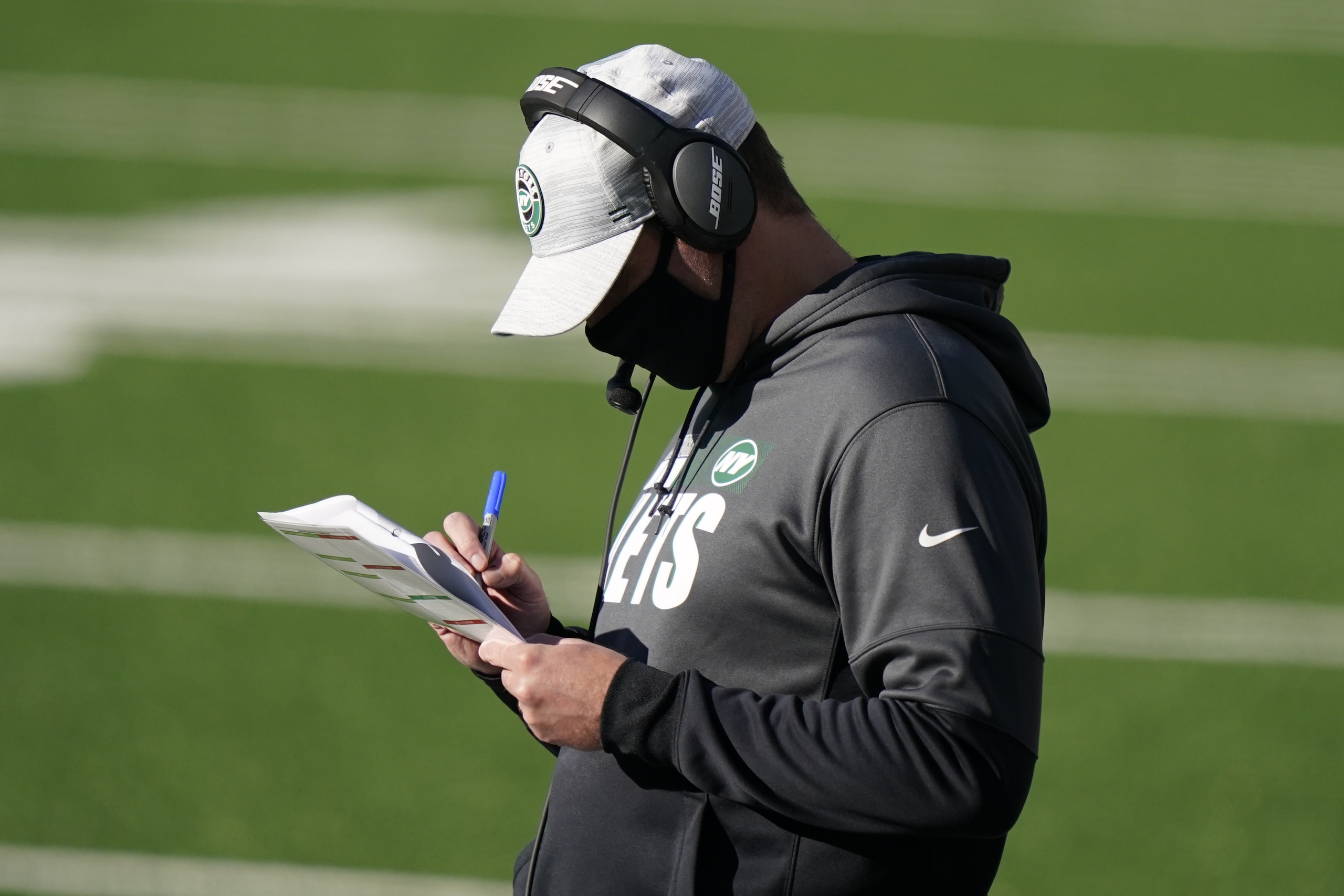 New York Jets head coach Adam Gase works on the sidelines during the first half of an NFL football game against the Miami Dolphins, Sunday, Nov. 29, 2020, in East Rutherford, N.J. (AP Photo/Corey Sipkin)