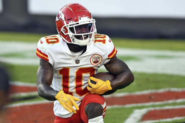Kansas City Chiefs wide receiver Tyreek Hill (10) smiles after scoring on a 44-yard touchdown reception against the Tampa Bay Buccaneers during the first half of an NFL football game Sunday, Nov. 29, 2020, in Tampa, Fla. (AP Photo/Jason Behnken)