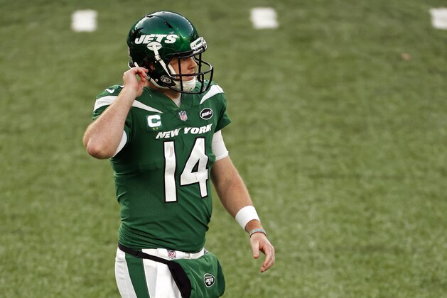 New York Jets quarterback Sam Darnold (14) reacts after throwing an interception during an NFL football game against the Miami Dolphins, Sunday, Nov. 29, 2020, in East Rutherford, N.J. (AP Photo/Adam Hunger)