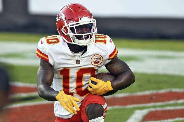 Kansas City Chiefs wide receiver Tyreek Hill (10) smiles after scoring on a 44-yard touchdown reception against the Tampa Bay Buccaneers during the first half of an NFL football game Sunday, Nov. 29, 2020, in Tampa, Fla. (AP Photo/Jason Behnken)